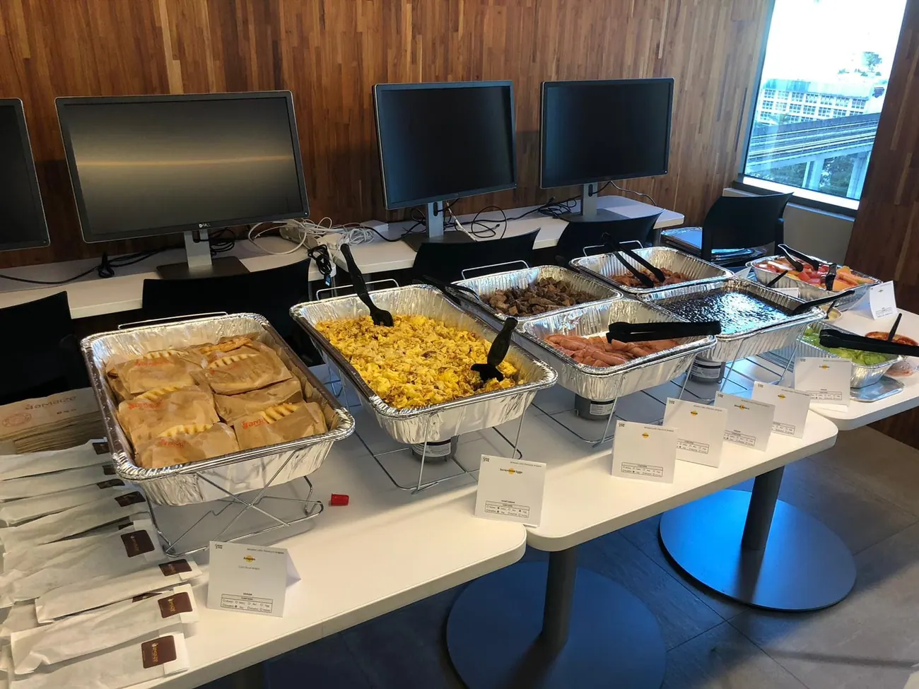 Corporate office catering setup with empanadas and rice